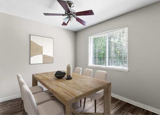A dining room with a wooden table and chairs.