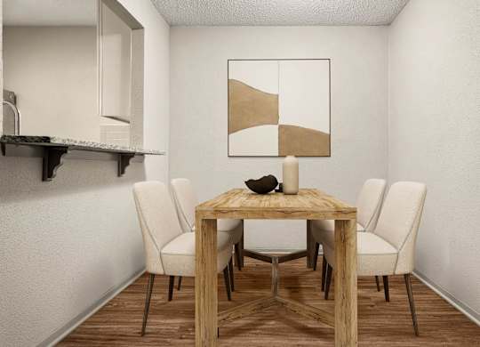 A dining table with four chairs and a bowl on top.