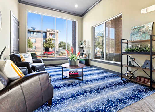A living room with a couch, chair, and a coffee table.