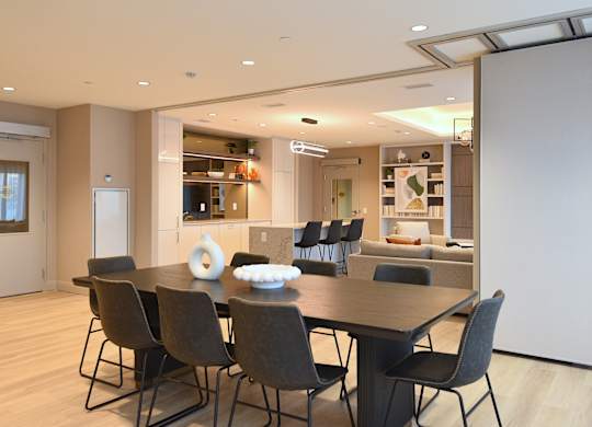 A modern dining room with a table set for four at Roxy Apartments, Hamilton, ON