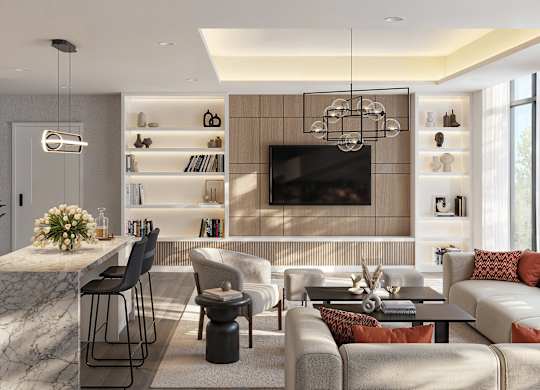 A modern living room with a kitchen area in the background.