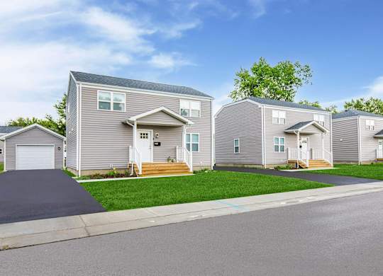 A row of houses with a driveway in front at Poplar Place Apartments, Springfield