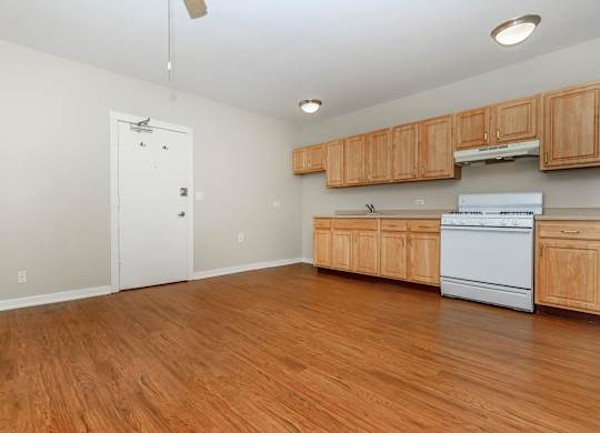 A kitchen with wooden cabinets at Sheridan Park, Chicago
