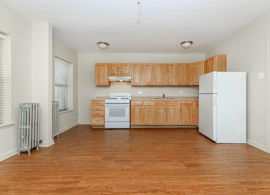A kitchen with wooden cabinets at Sheridan Park, Chicago, 60640
