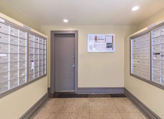 A hallway with a wall of mailboxes at Sheridan Park, Chicago