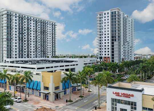 Two tall buildings are in the background of a Las Vegas sign. at Palma, Doral, FL, 33166