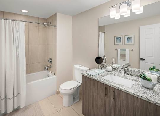 A modern bathroom with a white shower curtain and a white toilet. at Palma, Doral, Florida
