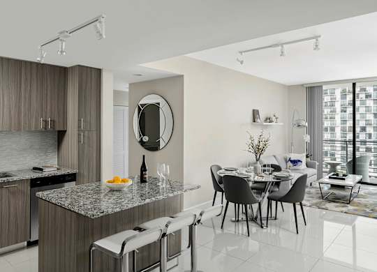 A modern kitchen with a dining  at Palma, Doral, FL