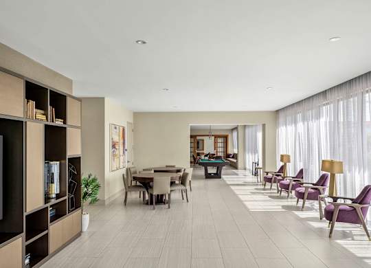 A modern living room with a dining area and a television. at Palma, Florida