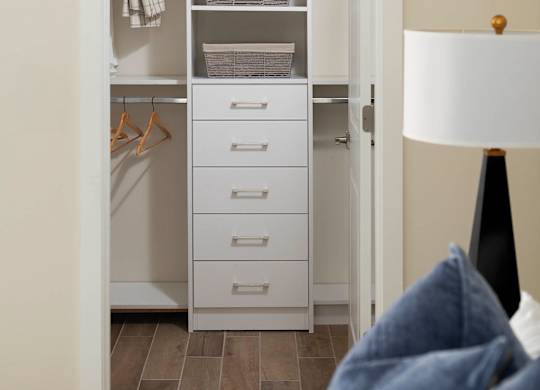 A white wardrobe with a white bed in front of it. at Palma, Florida, 33166