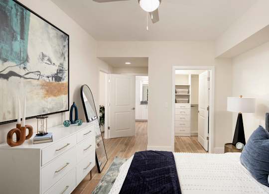 A bedroom with a large bed and a painting on the wall. at Palma, Doral, Florida