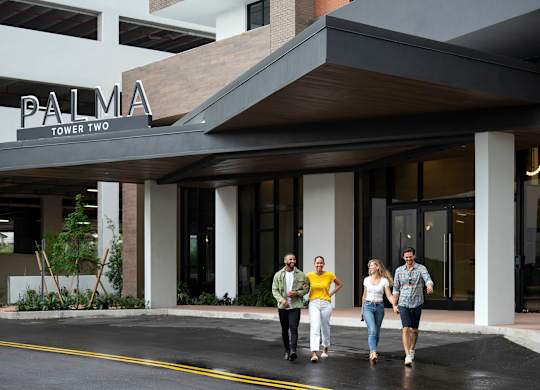 Four people are walking  at Palma, Doral, FL, 33166