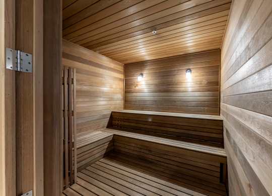 A wooden sauna with benches at Palma, Doral