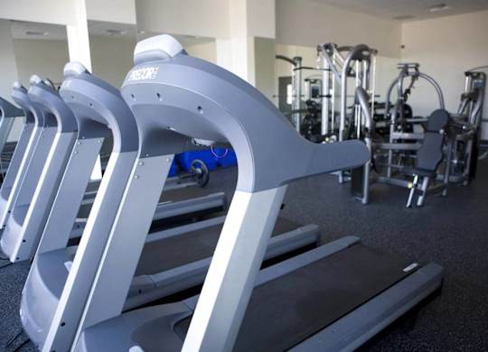 A gym with treadmills and other exercise equipment.at 66 Main, Yonkers, NY