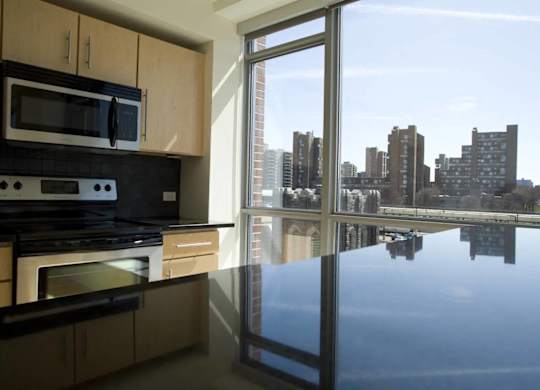 A kitchen with a view of the city.at 66 Main, New York, 10701