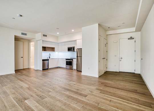 A spacious kitchen with a dining area and a living room.at The Dillon, Los Angeles California