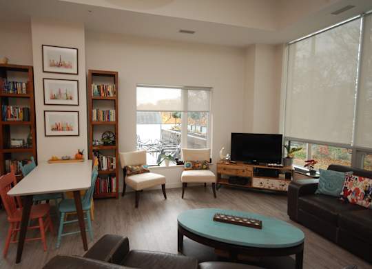 A living room with a white table and a couch.
