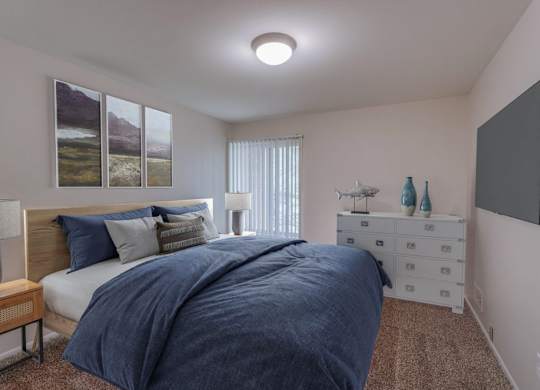 A bedroom with a large bed and a painting on the wall.