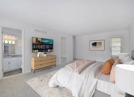 A bedroom with a bed, a dresser, and a painting on the wall.