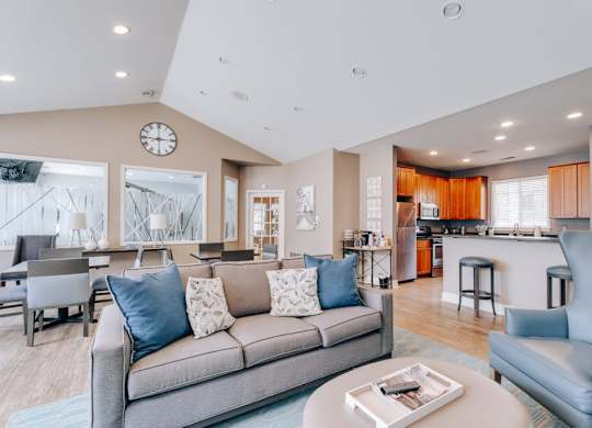 A modern living room with a grey sofa and a coffee table.