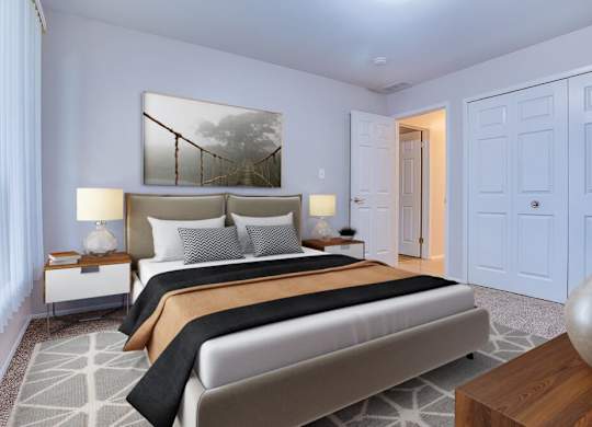 A bedroom with a large bed and a painting on the wall.