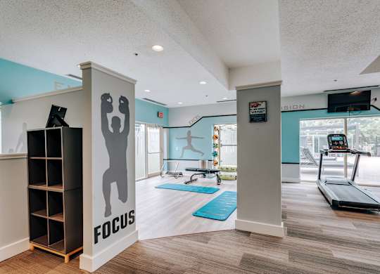A gym with a focus sign on the wall.