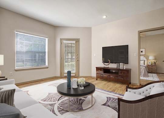 A living room with a black coffee table and a white sofa.
