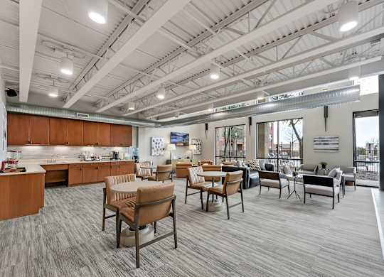 A modern office space with wooden furniture and a large window.