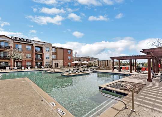 A pool area with boats and a building in the background.