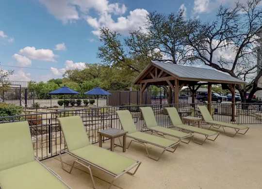 A sunny day at the outdoor seating area with yellow chairs and tables.