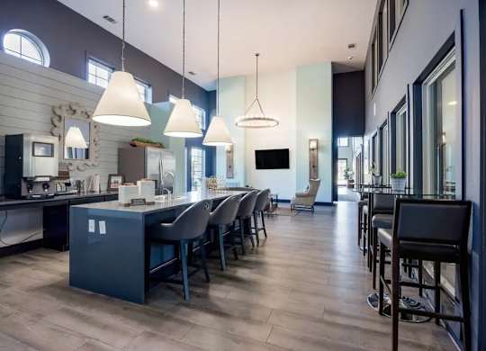 A modern kitchen with a dining area and a bar.