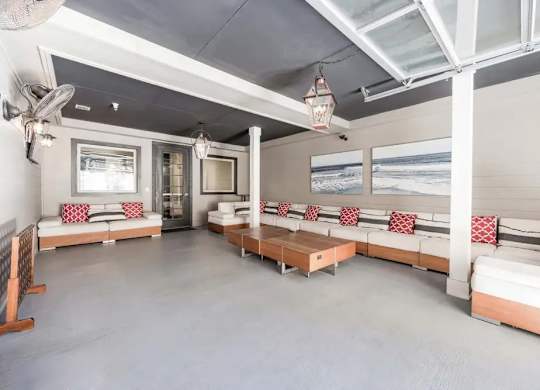 A living room with a couch and a table.