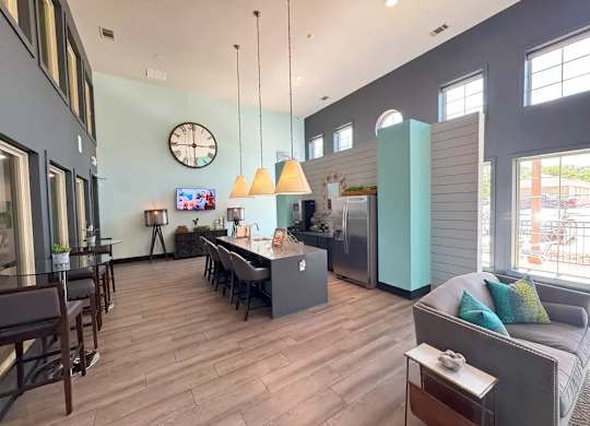 A modern kitchen with a dining table and chairs.