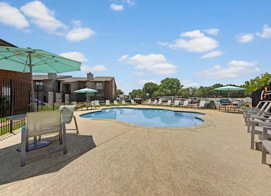 Resort style swimming pool with sun deck at South Meadows Apartments, Red Oak