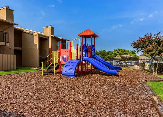 Childrens play area with mulch surface at South Meadows Apartments, Red Oak, Texas