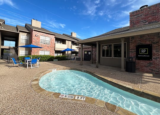Pool area with covered patio seating at Ashwood Park Apartments, Texas, 75252