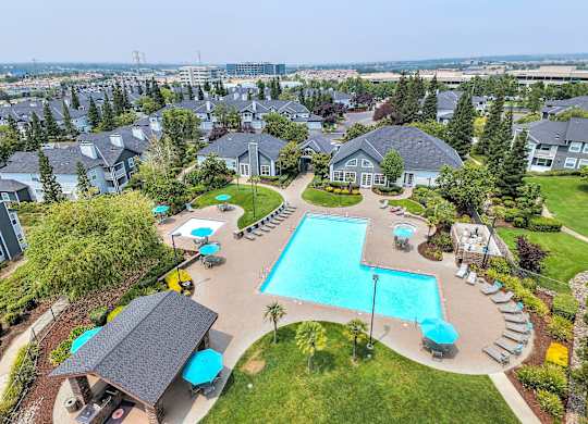 Aerial view of resortstyle pool with sun deck at Rosemeade Apartments, Roseville, 95661