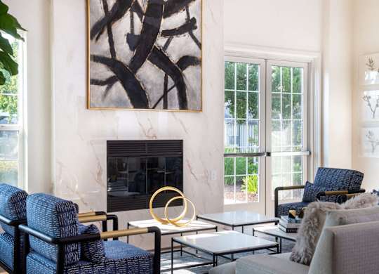 Living room with fireplace and modern decor at Rosemeade Apartments, Roseville, CA