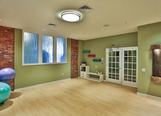A room with a green wall and a white door.