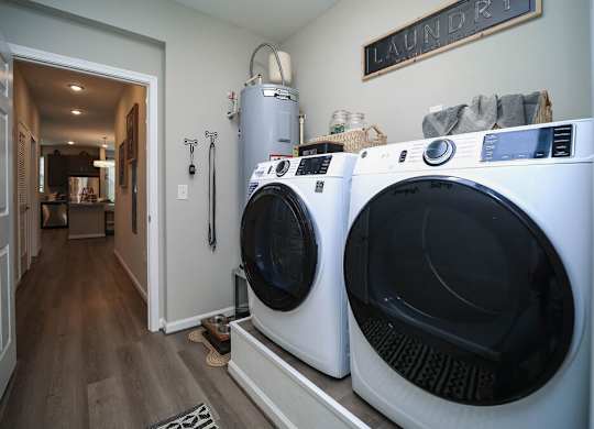 A laundry room with a washer and dryer.