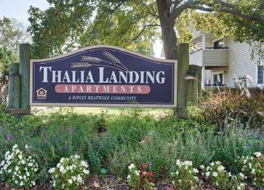 A sign for Thalia Landing Apartments in a Ripley Heatho community.