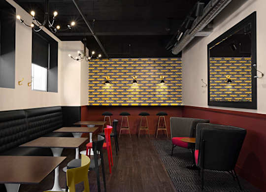 A restaurant with tables and chairs and a brick wall.