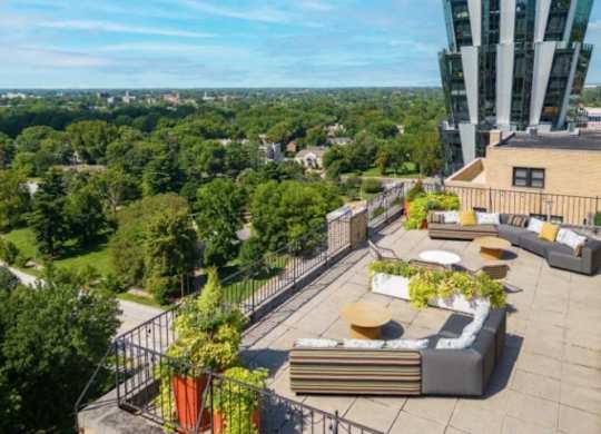 A rooftop patio with a view of the city.