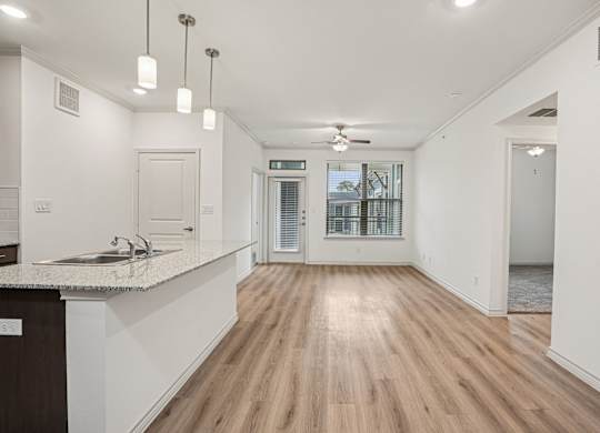 A kitchen with a counter and a sink.