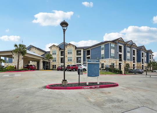 A large building with a parking lot in front of it.