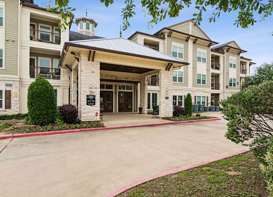 A large building with a covered walkway entrance.