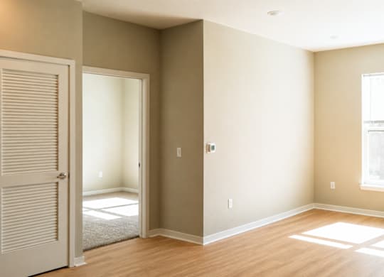 A room with a door and a window.