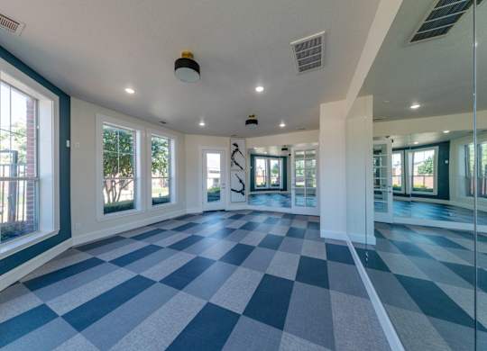 A large room with a checkered floor and white walls.