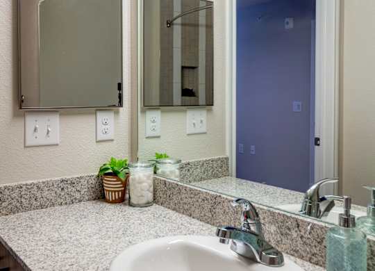 A bathroom sink with a mirror above it.