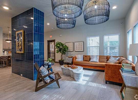 A living room with a blue wall and a wooden chair.